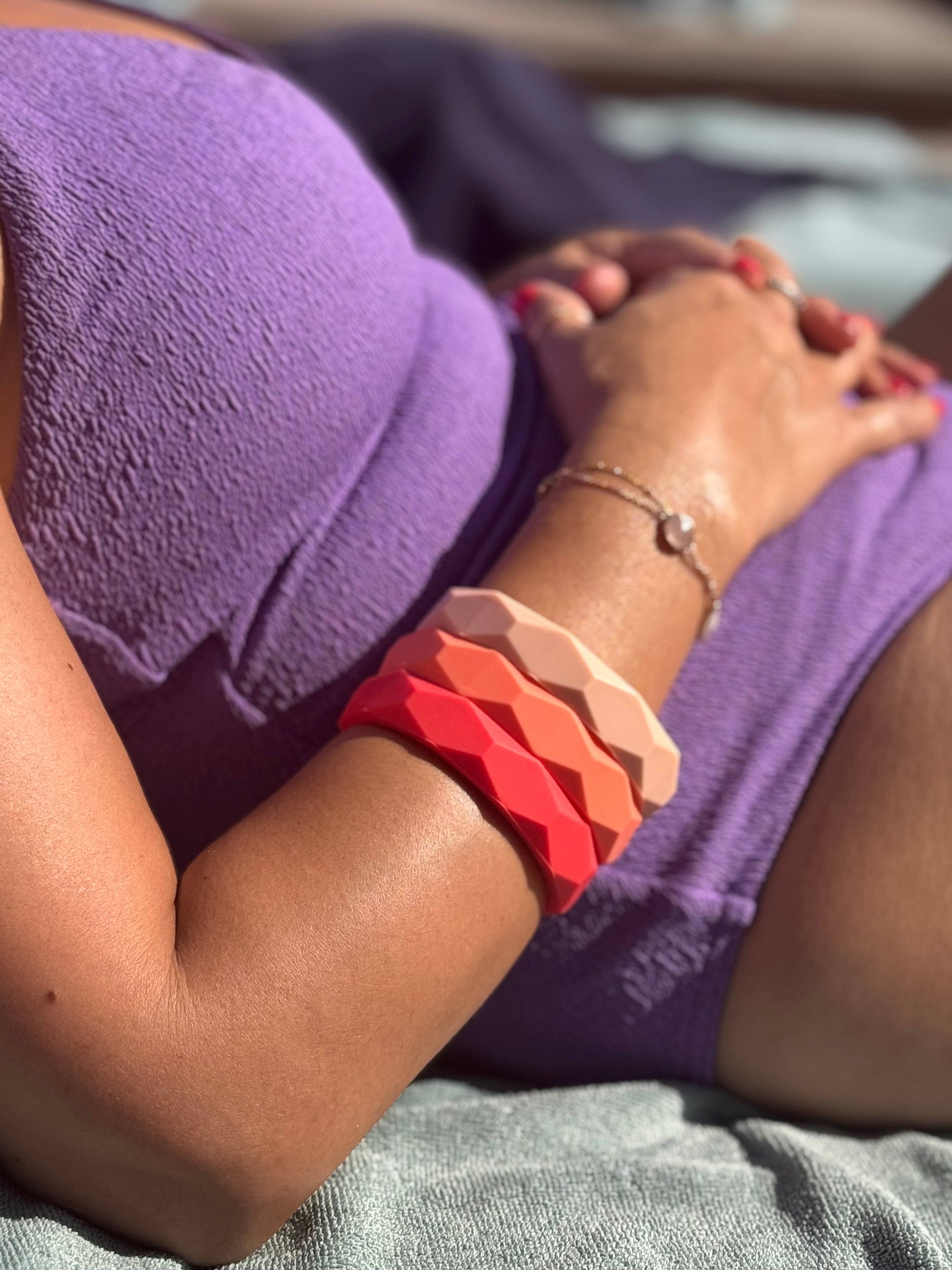 Person wearing purple shorts with a blurred background