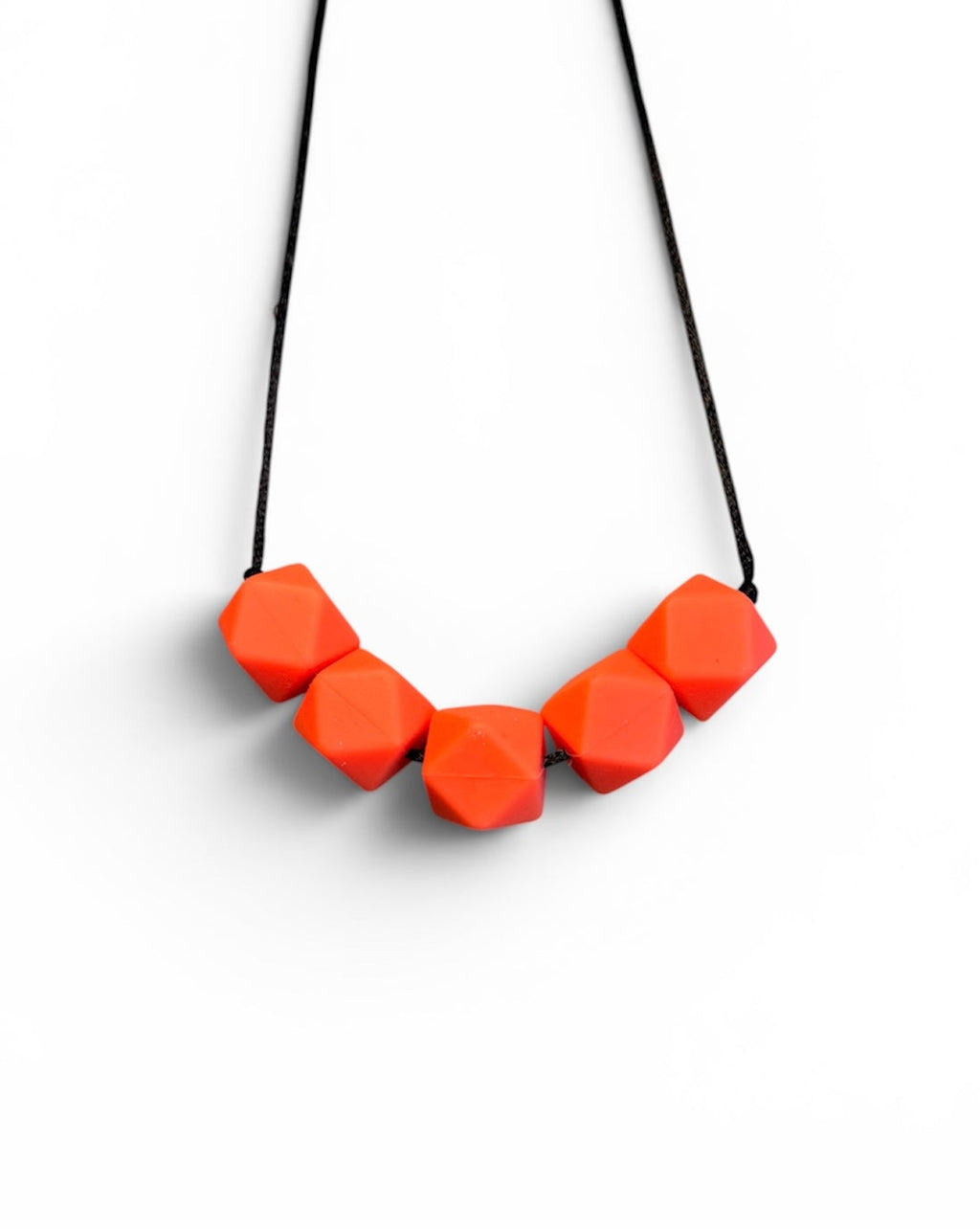 Necklace with orange geometric beads on a white background