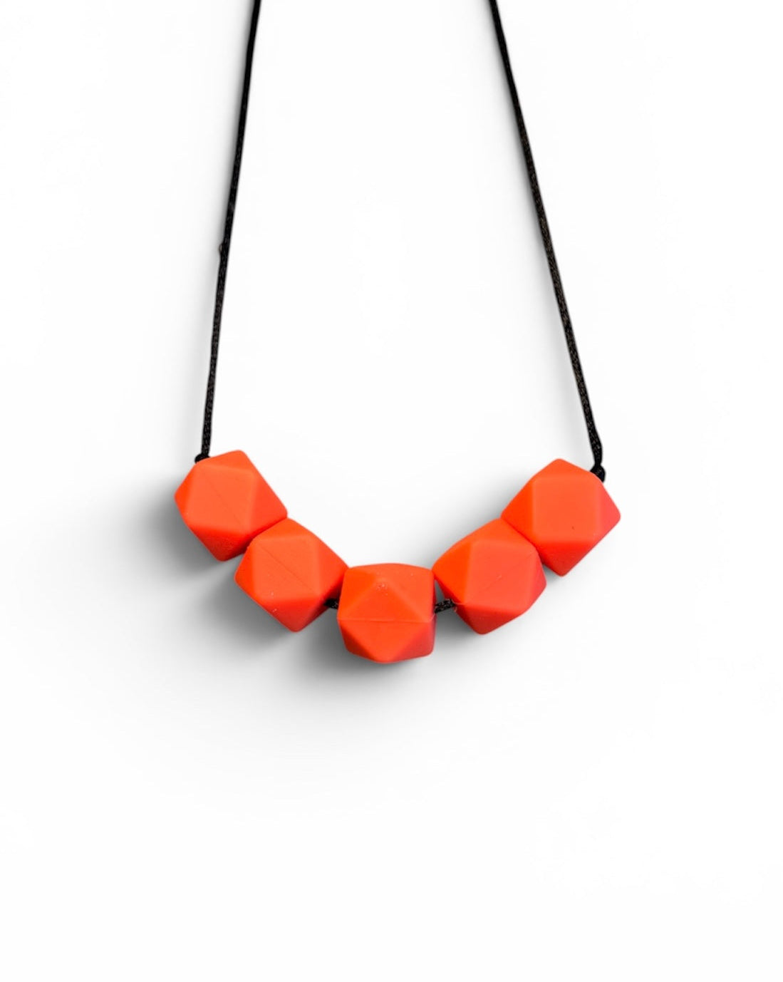 Necklace with orange geometric beads on a white background